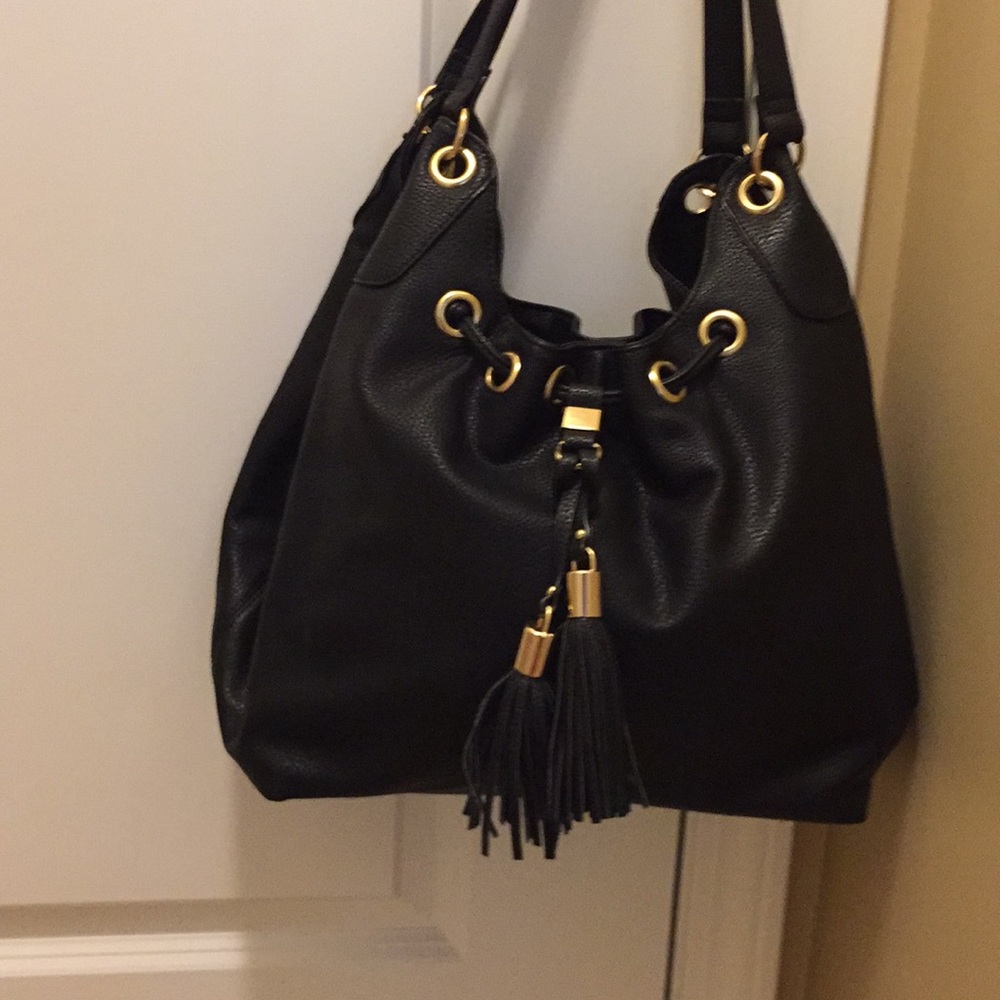 Black purse with tassels